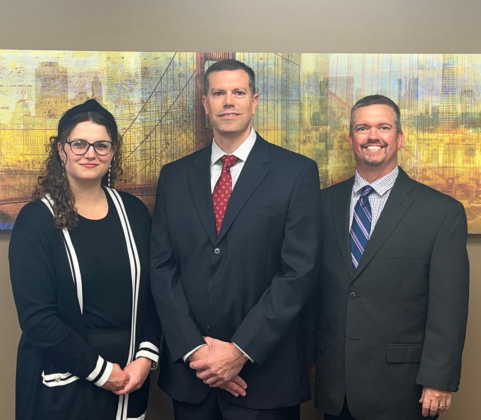 The team at HighPoint Advisors, LLC poses for their group photo in their office in Syracuse, NY.